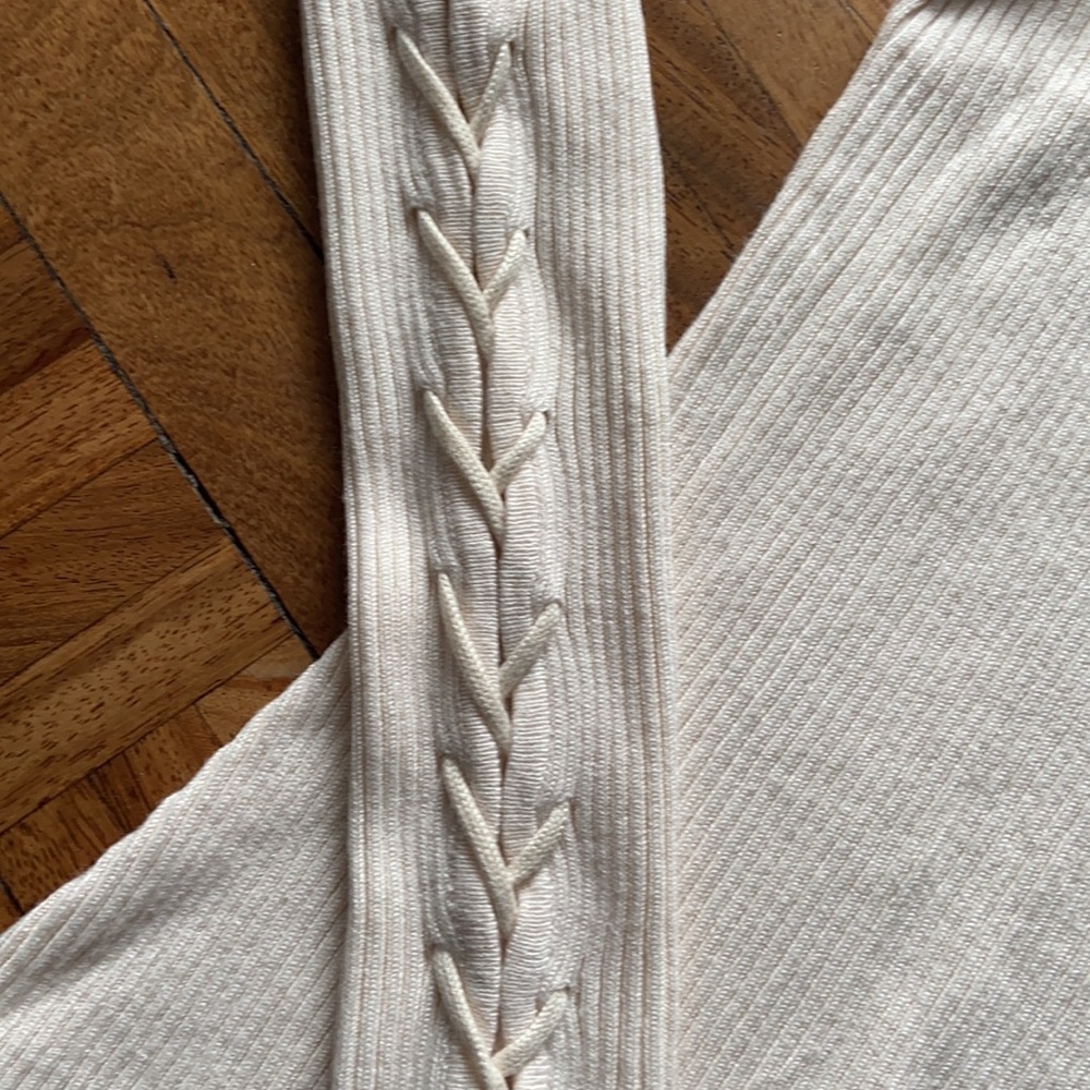 NWT River Island cream top with lace up detailing on the sleeves.